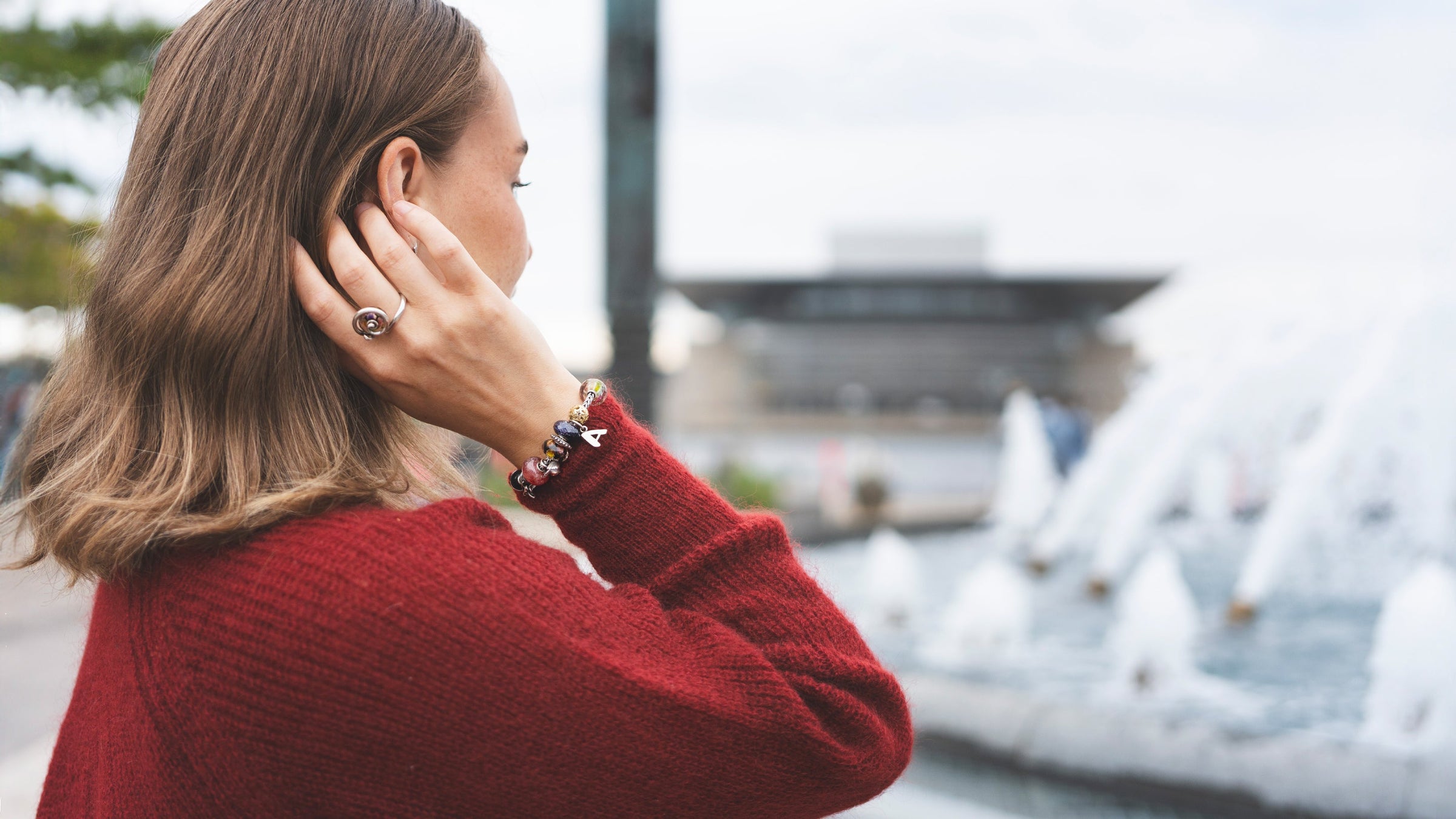 Trollbeads model wearing winter jewellery collection 2024 on ring and bracelet